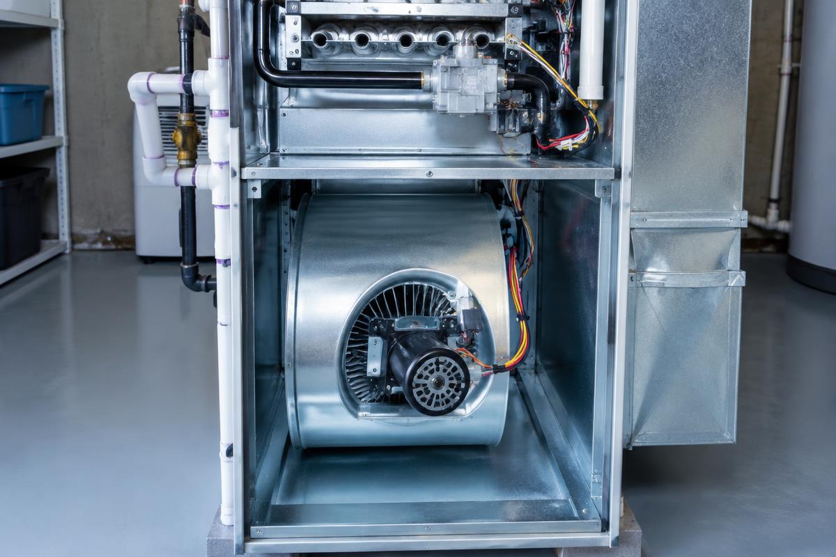 Clean furnace blower compartment with the front panel open